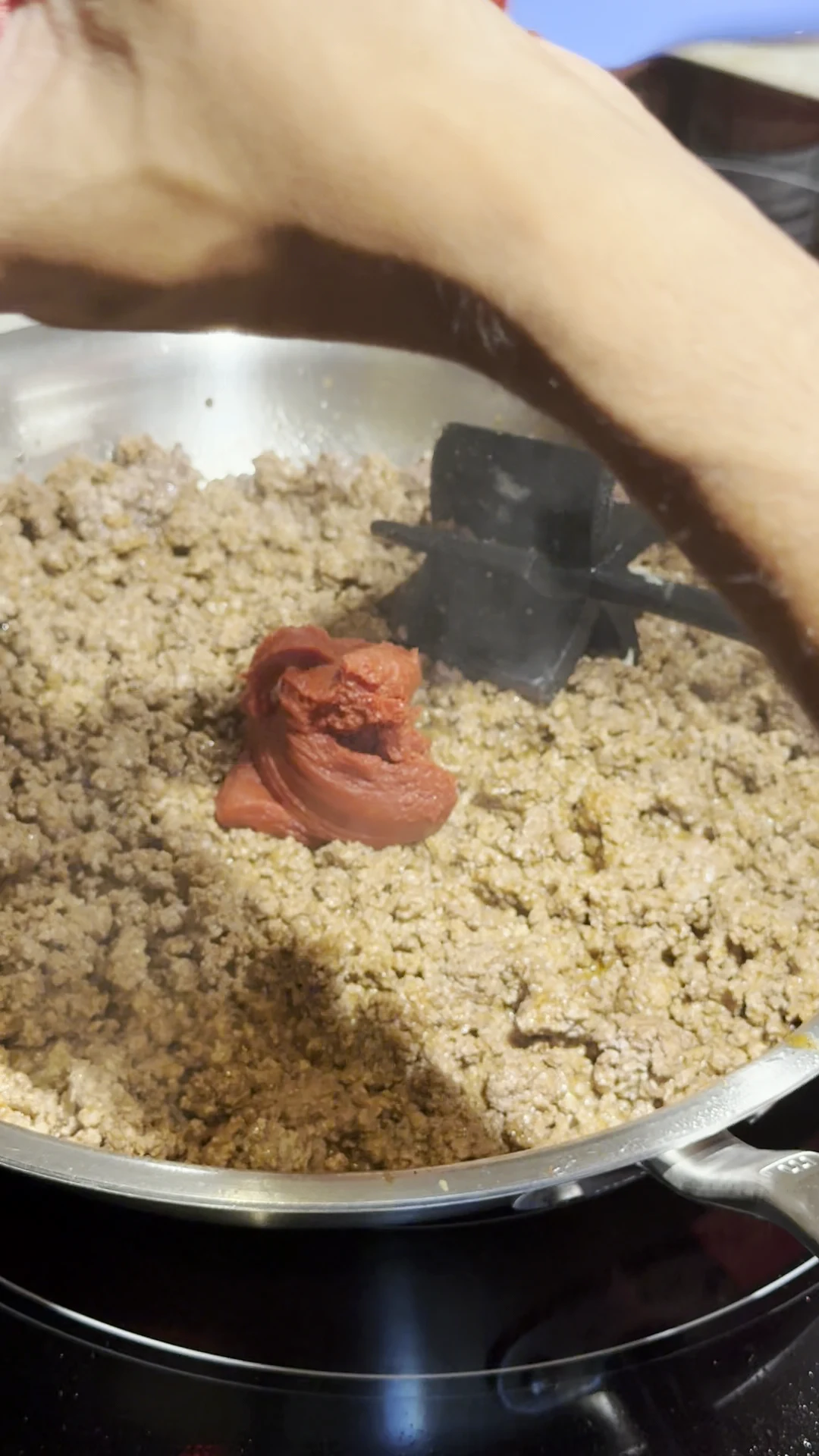 Step photo: add tomato paste