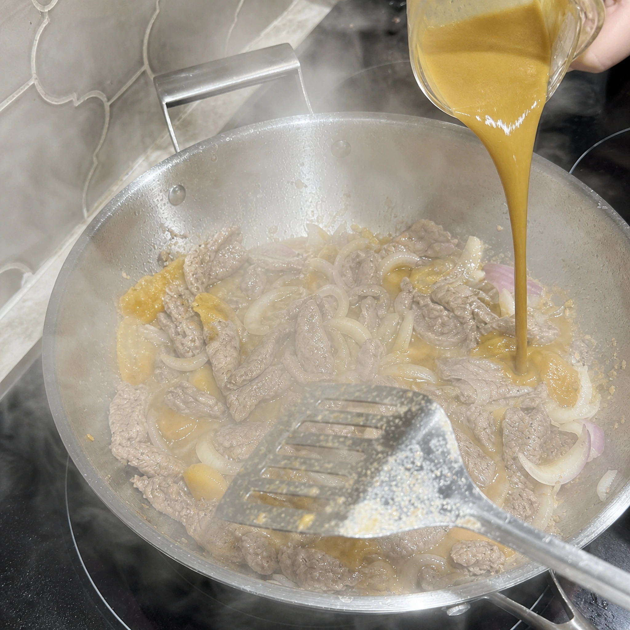 Step photo: return beef and sauce polished