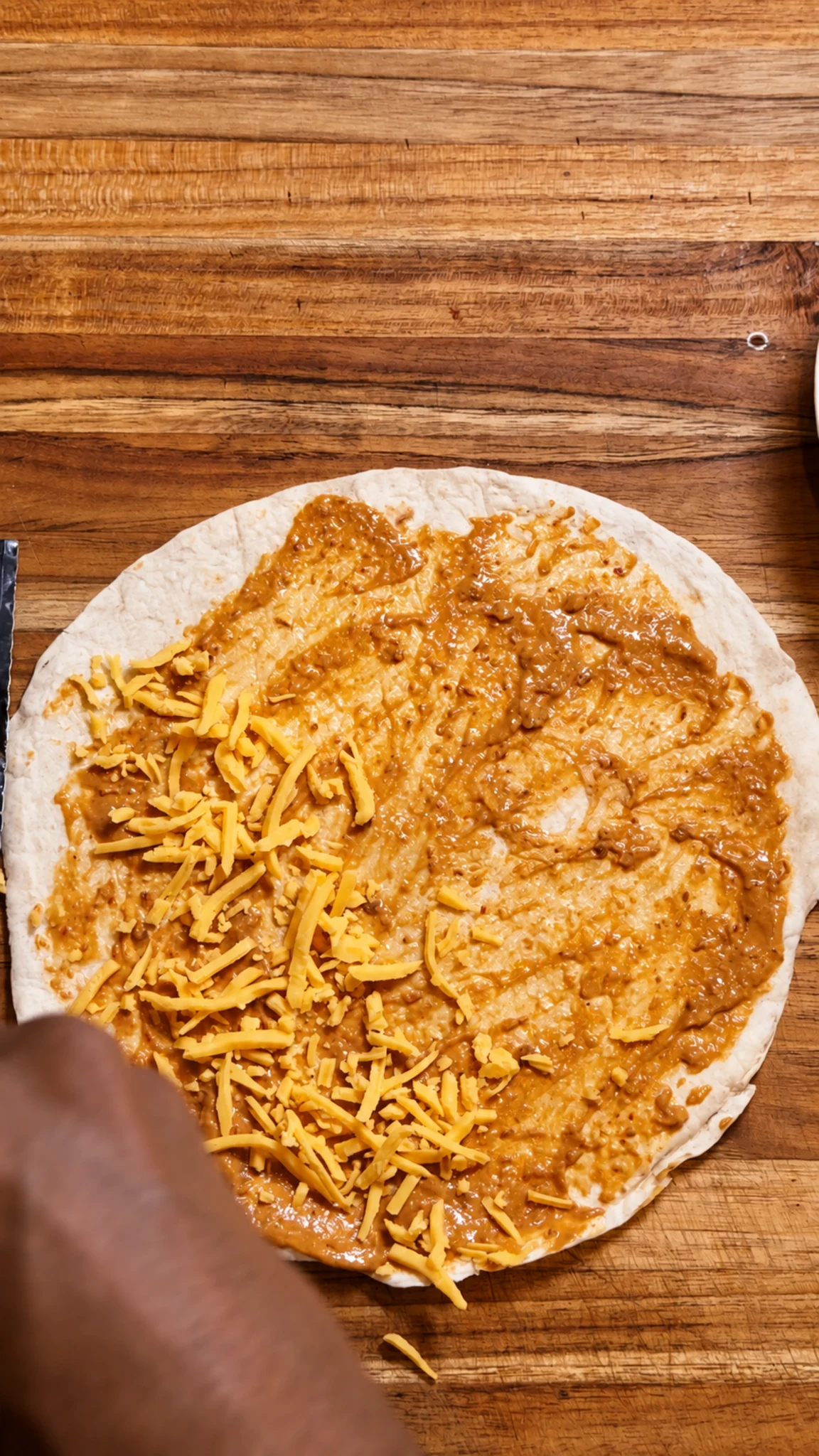 Step photo: add velveeta shreds